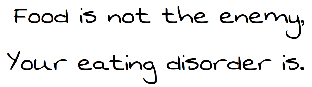 Handgeschreven tekst op zwarte achtergrond: “Food is not the enemy, your eating disorder is.”